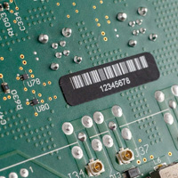 A label with a barcode on a circuit board.