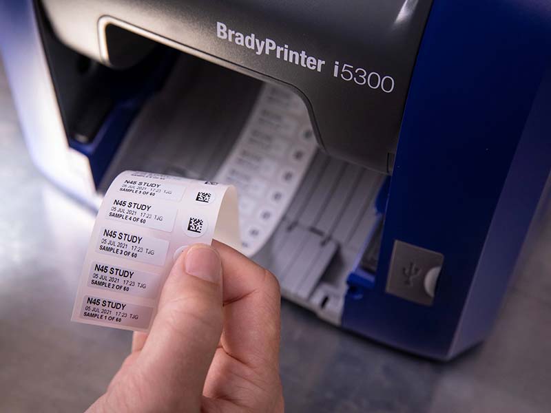 A Brady I5300 printing lab sample labels for an RFID management system.