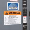 An electrical panel with multiple safety and warning labels.