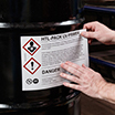 Hazardous material label on drum