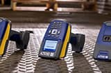 A dramatic photo of several of Brady's industry-leading handheld barcode scanners. 