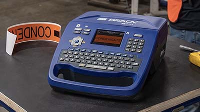 Creating pipe markers using an M710 label printer.