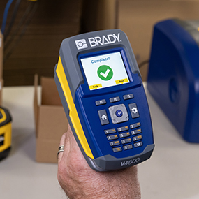 A Brady V4500 scanner displaying a confirmation message that a kit is correct