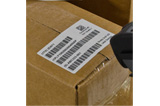 A close up of a barcode label on a package.