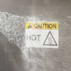 A label applied to a piece of equipment that is being sprayed down to clean it.